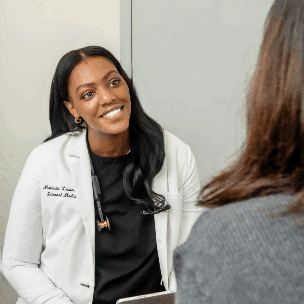 Doctor consulting with a patient in office.
